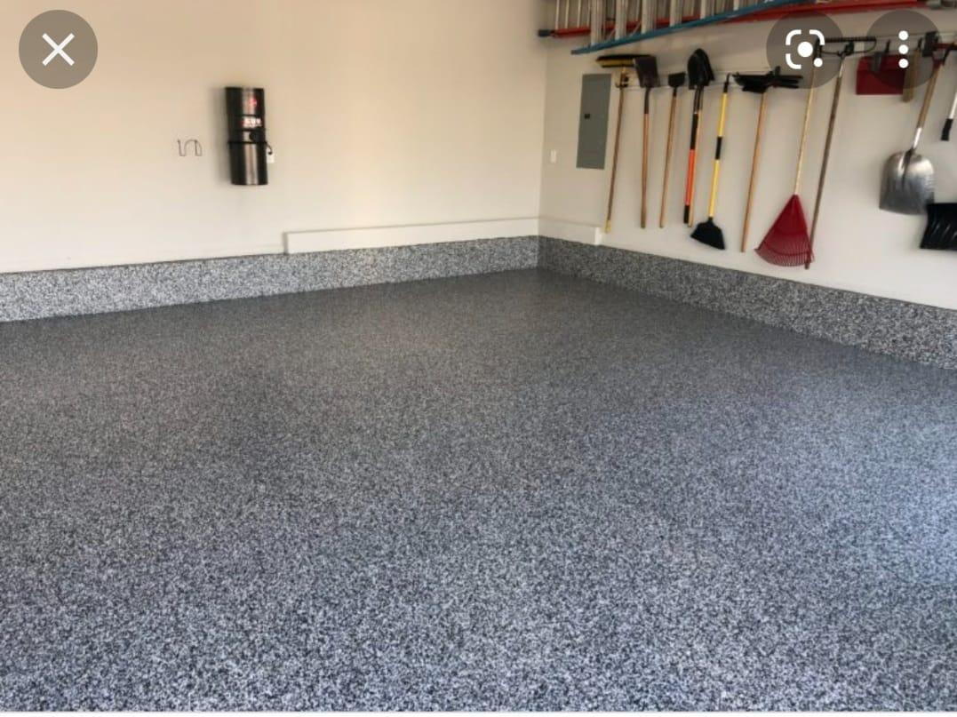 Epoxy garage floor with cove base by Butterfly Floorings